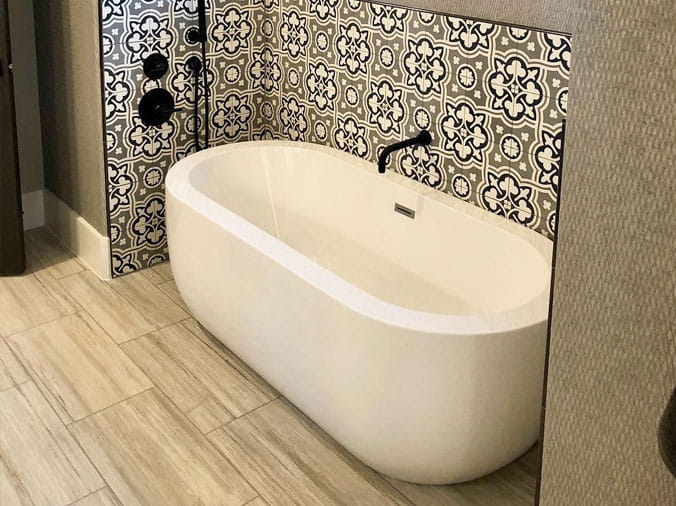 Oval shaped free standing bathtub at FACETS Kitcen & Bath Showroom in Denton Texas