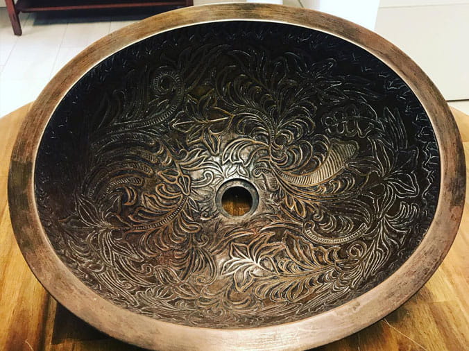 Fancy brass sink basin with etched design